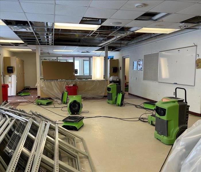 Pictured is a classroom that just experienced a water damage with Servpro equipment set. 