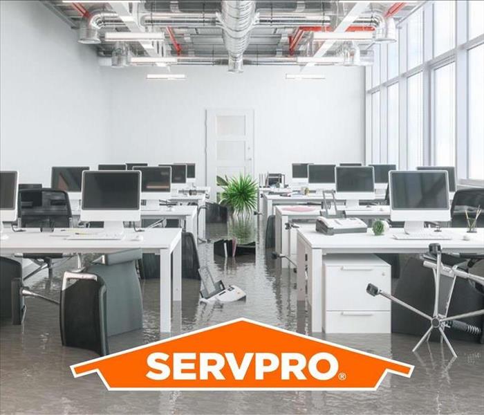 Pictured is a business that has experienced significant flooding damage with the Servpro logo.