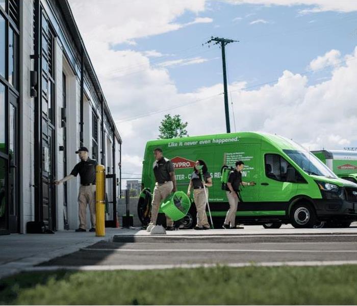 Pictured is Servpro employees heading into a business to provide cleaning services.